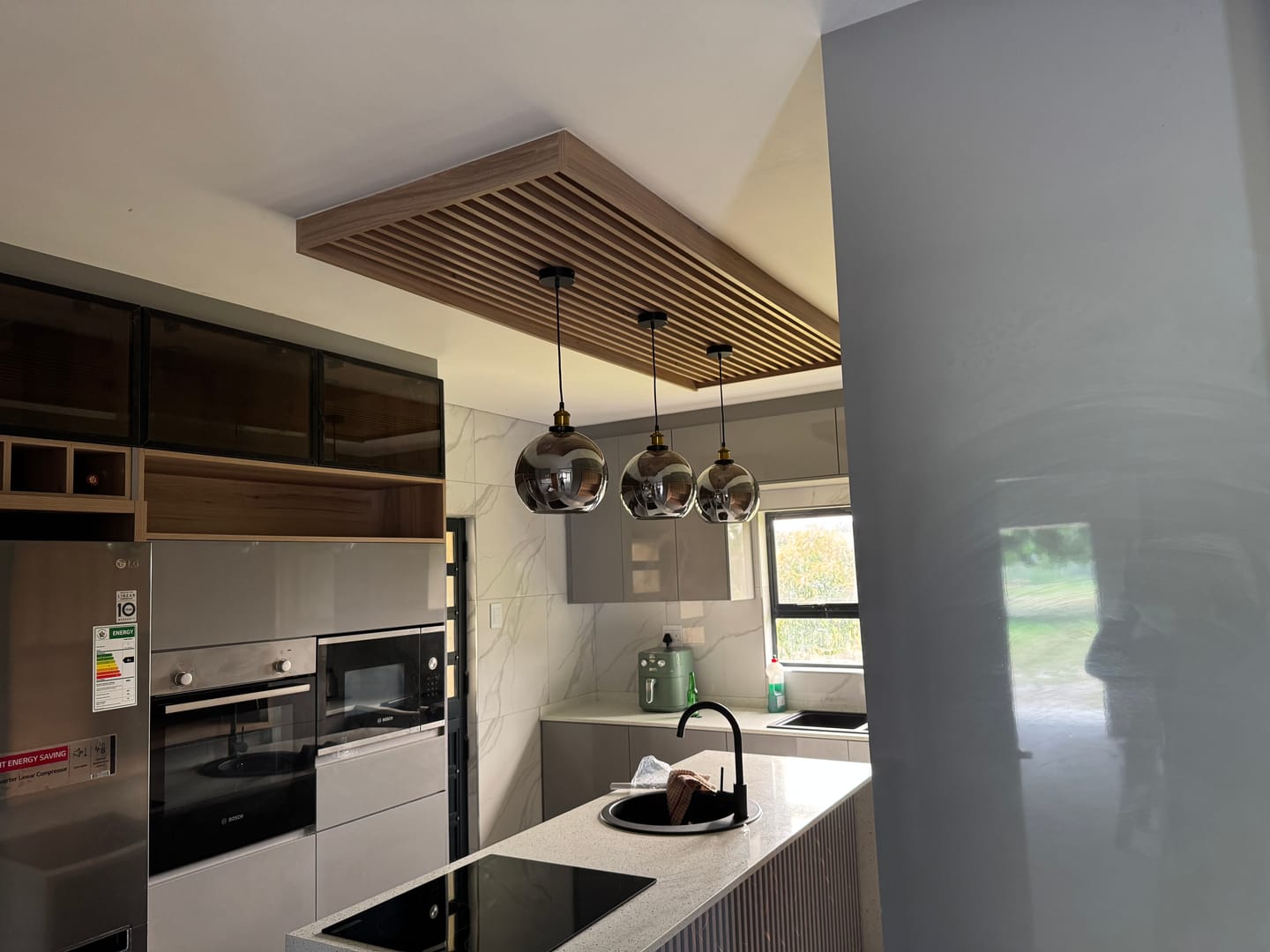 Customer photo review of Spheroid Glass Pendant Light Smoke | Amber