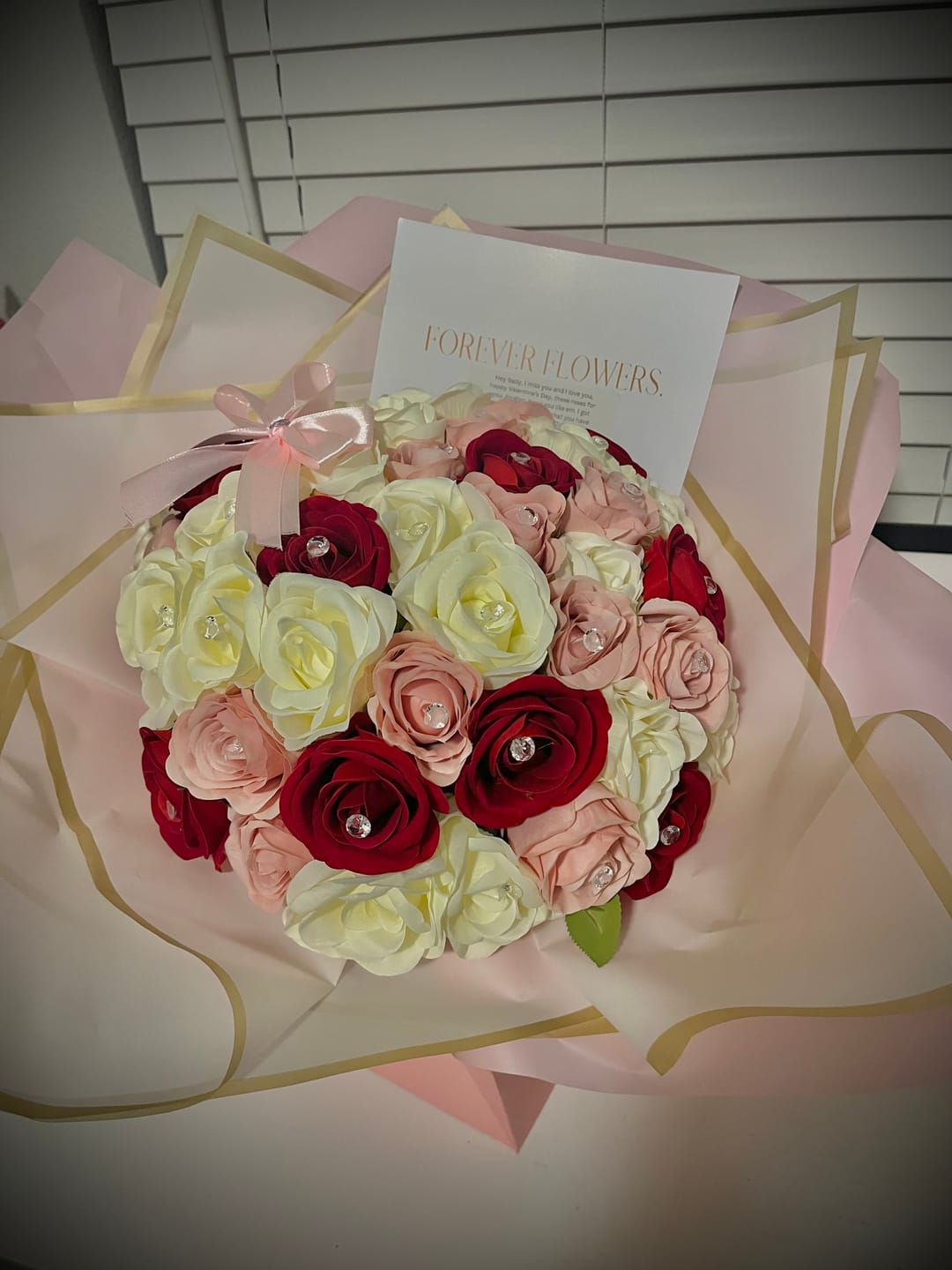 Customer photo review of 50 Mixed Pink, Red, Ivory Forever Roses