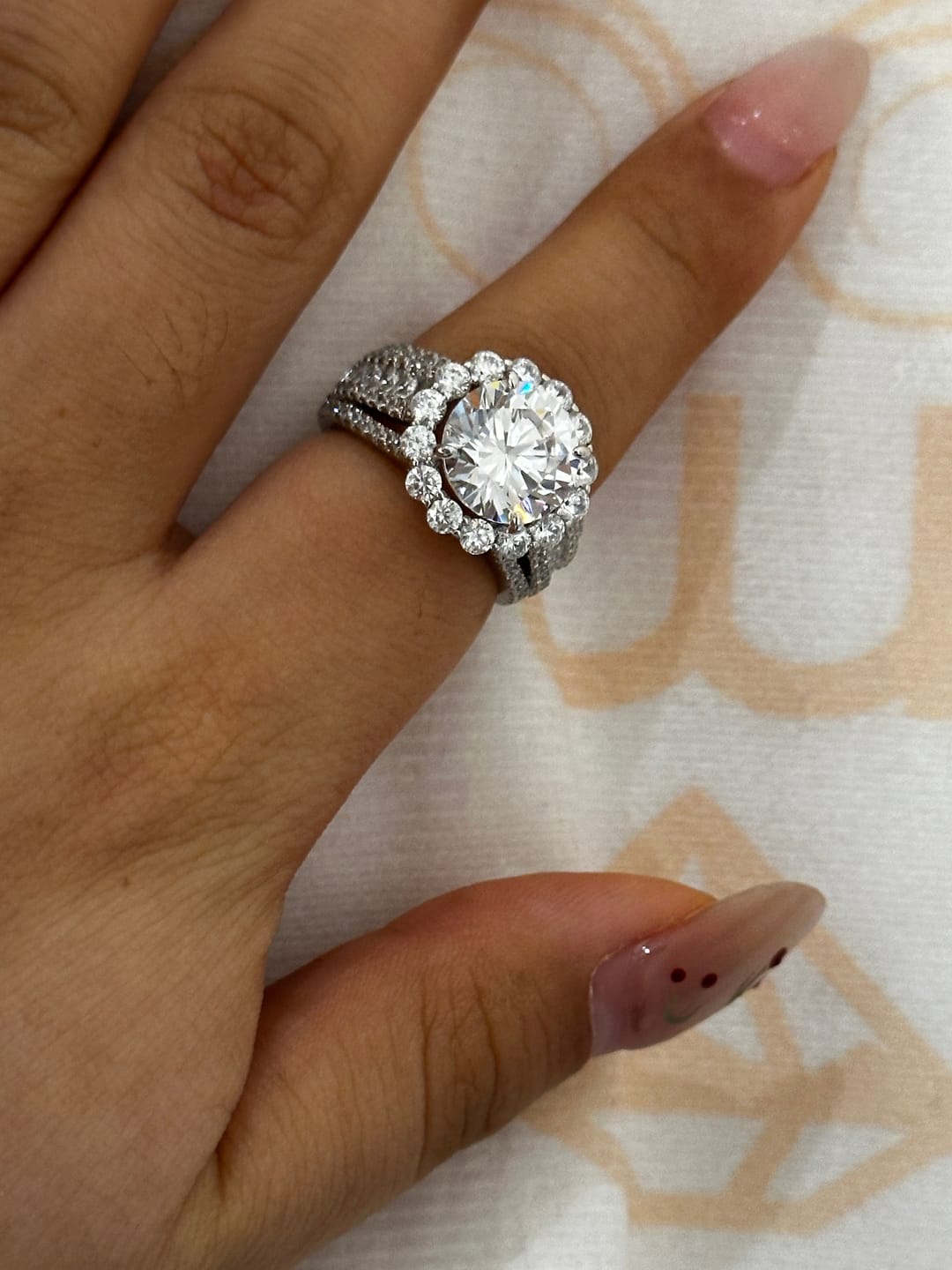 Customer photo review of Louily Unique Halo Design Round Cut Engagement Ring In Sterling Silver