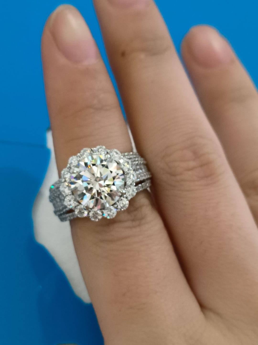 Customer photo review of Louily Unique Halo Design Round Cut Engagement Ring In Sterling Silver