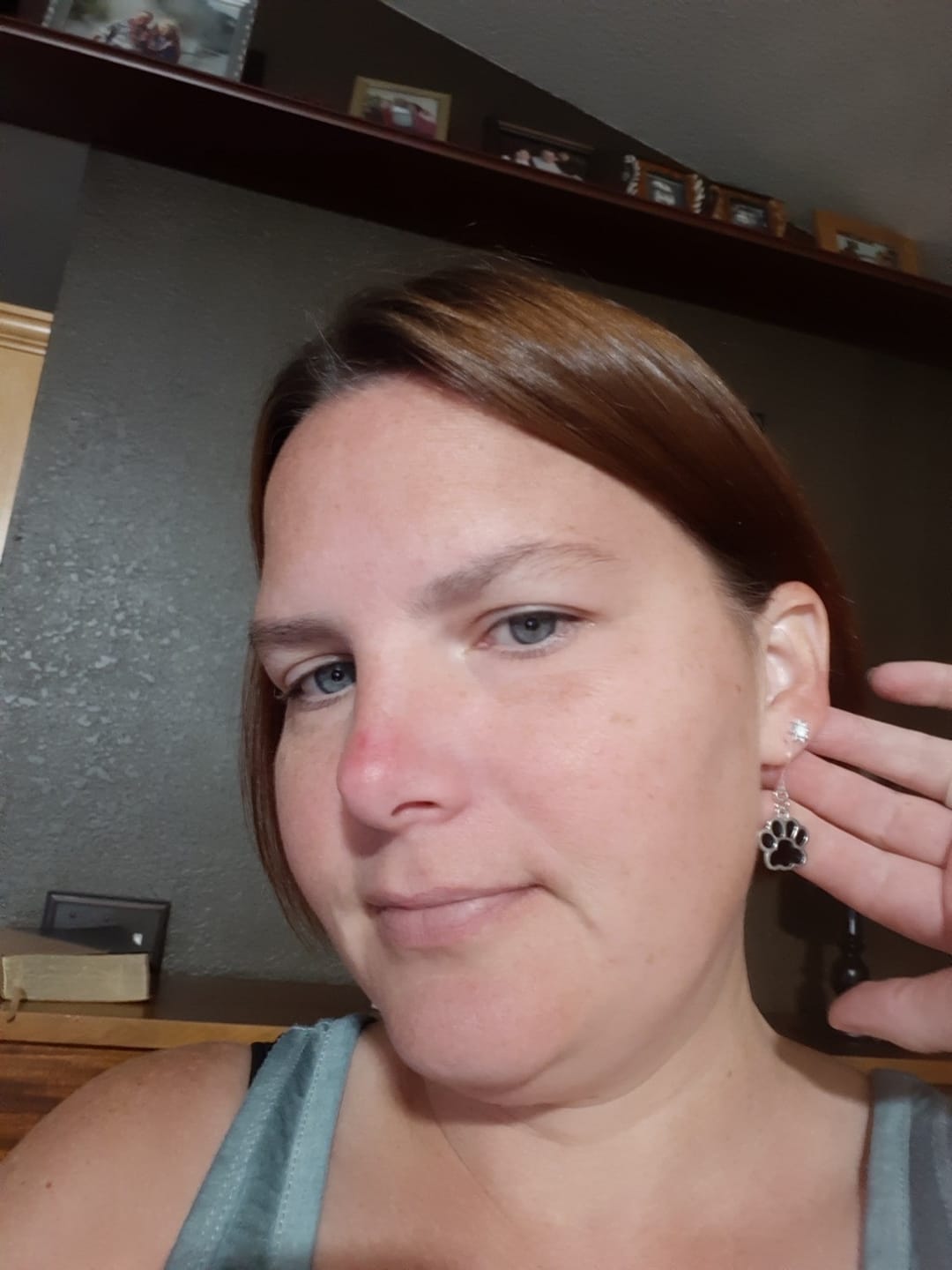 Customer photo review of Paw Print Dangles Hypoallergenic Earrings for Sensitive Ears Made with Plastic Posts