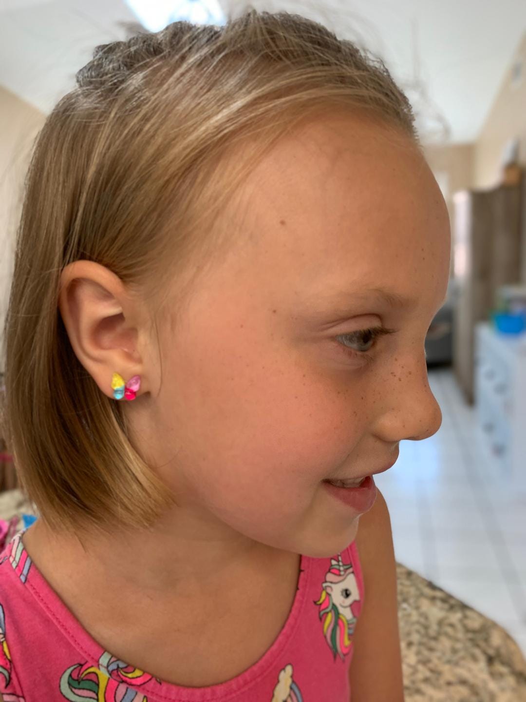 Customer photo review of Glassy Butterfly Studs Hypoallergenic Earrings for Sensitive Ears Made with Plastic Posts