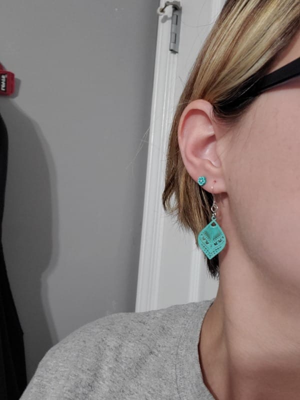 Customer photo review of Small Peacock Dangles Hypoallergenic Earrings for Sensitive Ears Made with Plastic Posts