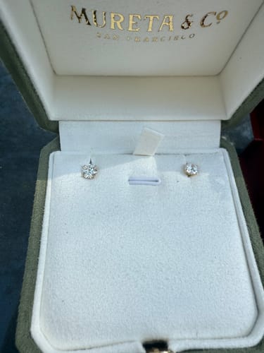 Customer photo review of M & Co. 4-Prong Martini Setting Diamond Stud Earrings