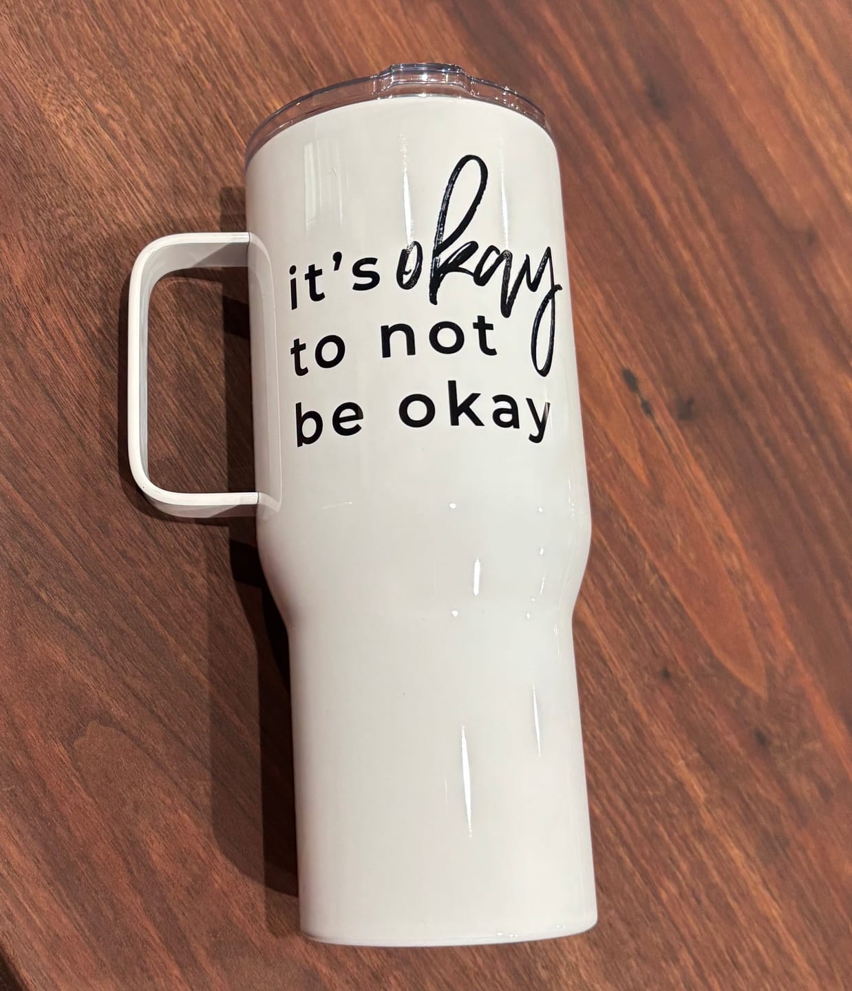 Customer photo review of It's Okay To Not Be Okay Travel mug with a handle