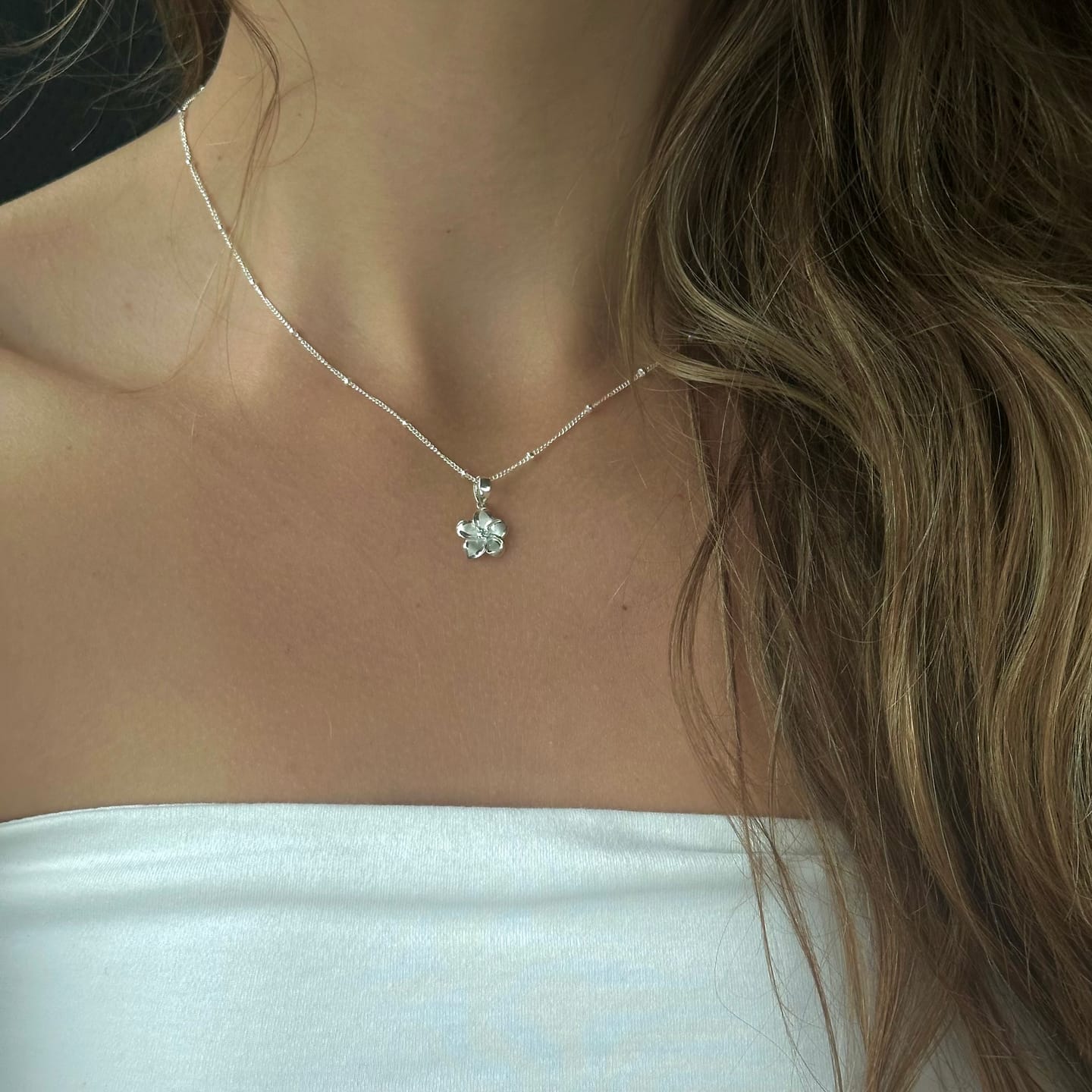 Customer photo review of Sterling Silver Small Plumeria Necklace w/ CZ 18"