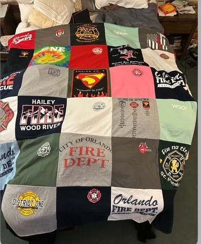 T-shirt quilt with firefighting, community service themes by Debora from FL