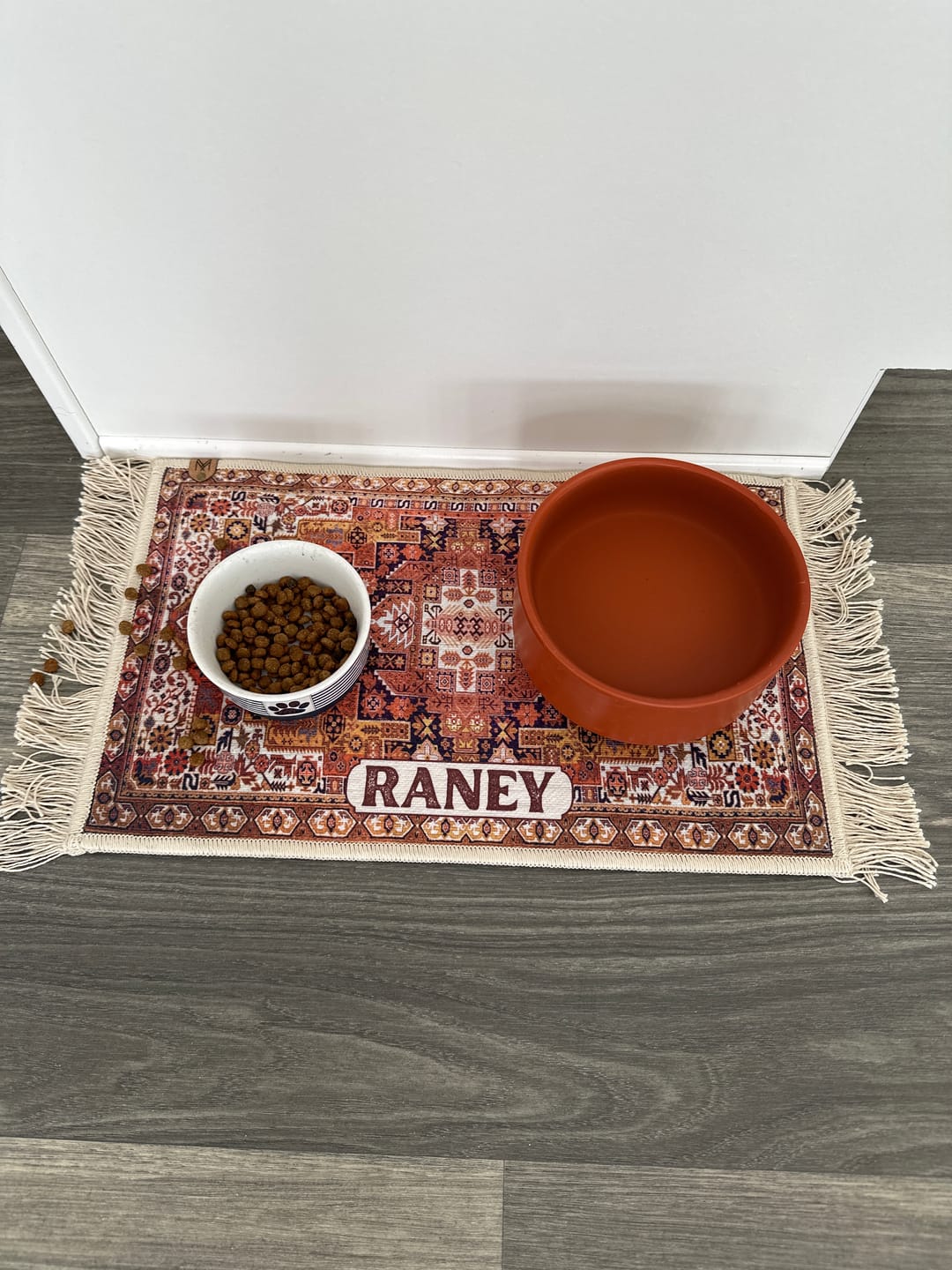 Customer photo review of Pet Bowl Mat with Fringe - Ophelia // Personalization: RANEY