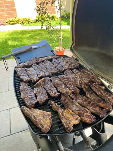 Reseña con foto de un cliente sobre Asado de Tira
