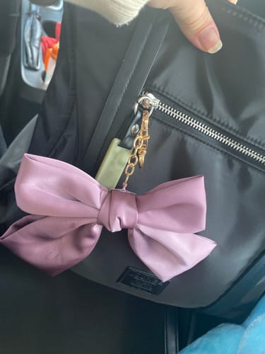 Reseña con foto de un cliente sobre Llavero Cinta