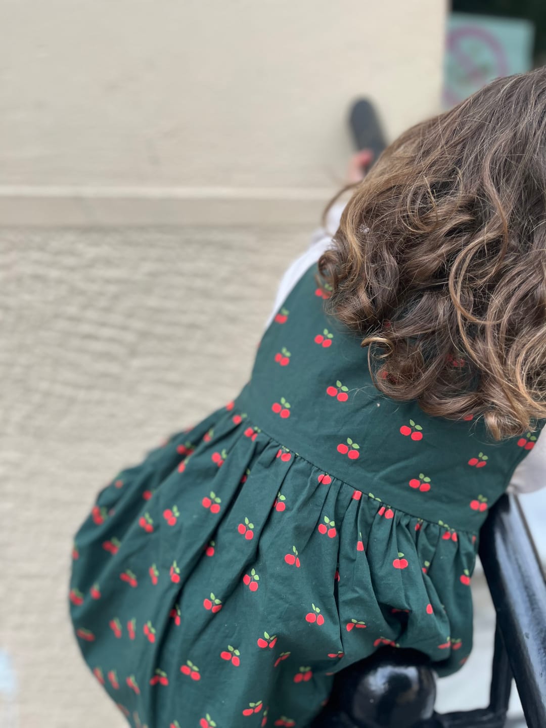 Customer photo review of Olive Cherries Reversible Pinny Dress