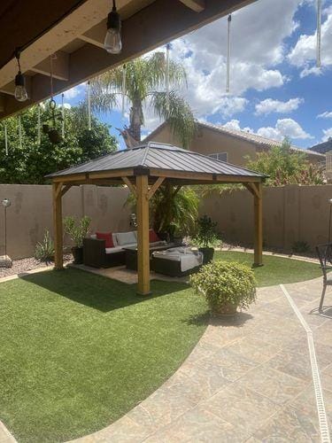 Customer photo review of SUNJOY 11x13 Wooden Gazebo with Solar Panel, LED Lights and Ceiling Hook - Driftwood Cedar