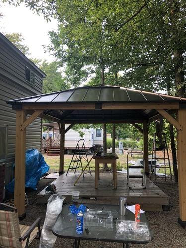 Customer photo review of SUNJOY 11x13 Wooden Gazebo with Solar Panel, LED Lights and Ceiling Hook - Driftwood Cedar