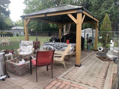 Customer photo review of SUNJOY 11x13 Wooden Gazebo with Solar Panel, LED Lights and Ceiling Hook - Driftwood Cedar