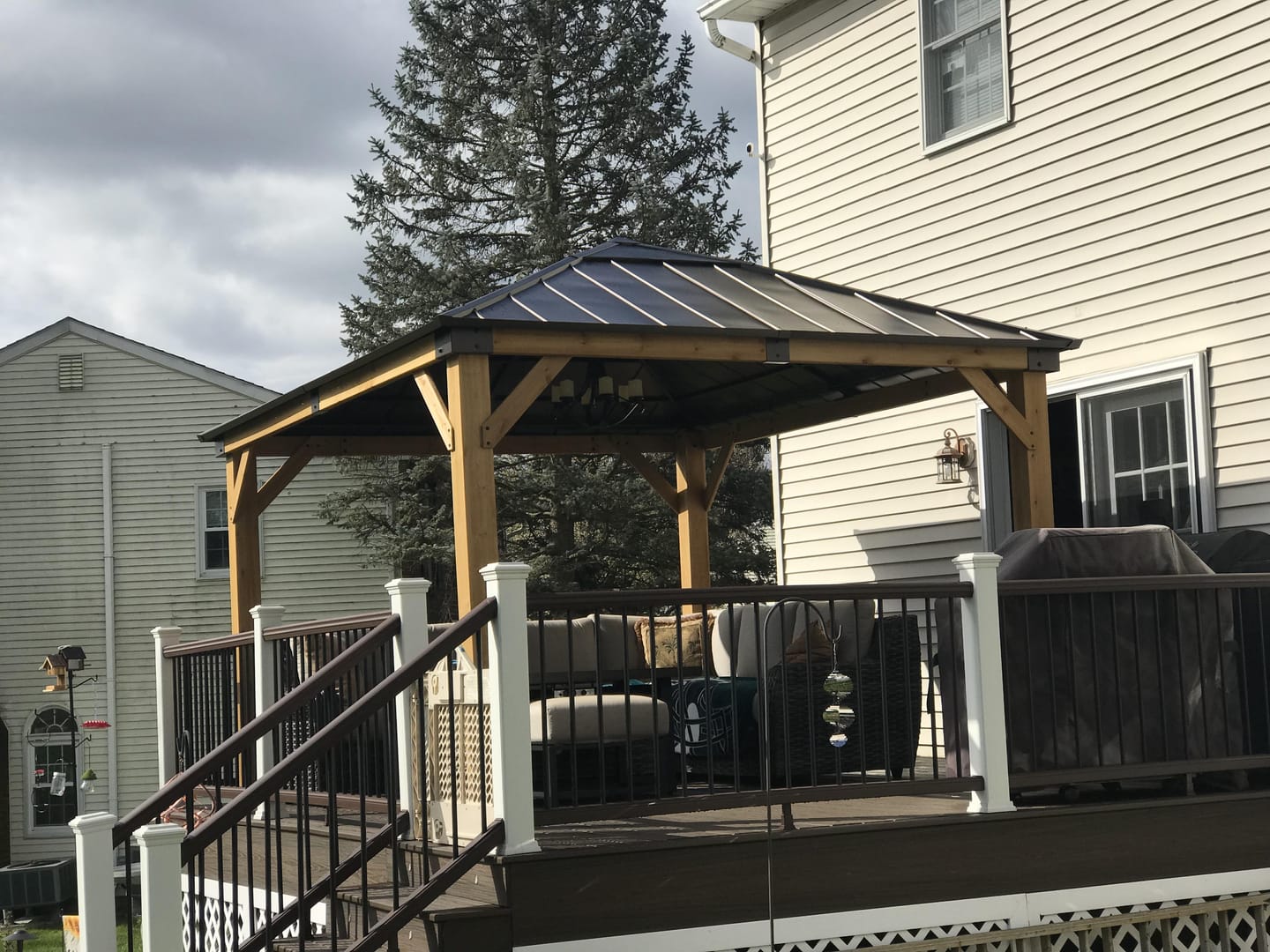 Customer photo review of SUNJOY 11x13 Wooden Gazebo with Solar Panel, LED Lights and Ceiling Hook - Driftwood Cedar