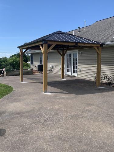Customer photo review of SUNJOY 11x13 Wooden Gazebo with Solar Panel, LED Lights and Ceiling Hook - Driftwood Cedar