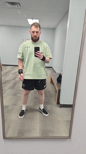 Customer photo review of God Wins Tee