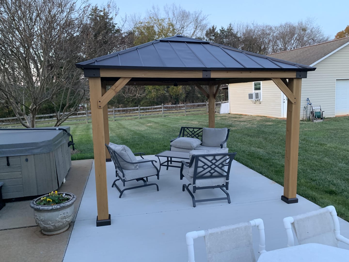 Customer photo review of SUNJOY 11x13 Wooden Gazebo with Solar Panel, LED Lights and Ceiling Hook - Driftwood Cedar