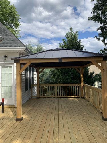Customer photo review of SUNJOY 11x13 Wooden Gazebo with Solar Panel, LED Lights and Ceiling Hook - Driftwood Cedar
