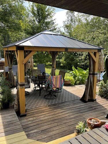 Customer photo review of SUNJOY 11x13 Wooden Gazebo with Solar Panel, LED Lights and Ceiling Hook - Driftwood Cedar
