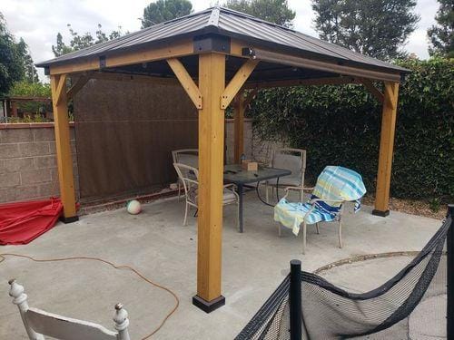 Customer photo review of SUNJOY 11x13 Wooden Gazebo with Solar Panel, LED Lights and Ceiling Hook - Driftwood Cedar
