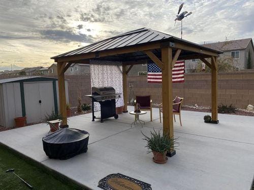 Customer photo review of SUNJOY 11x13 Wooden Gazebo with Solar Panel, LED Lights and Ceiling Hook - Driftwood Cedar