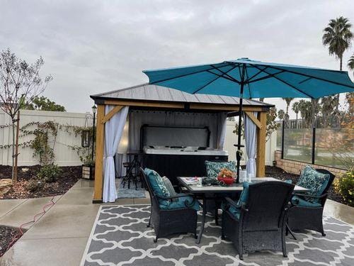 Customer photo review of SUNJOY 11x13 Wooden Gazebo with Solar Panel, LED Lights and Ceiling Hook - Driftwood Cedar