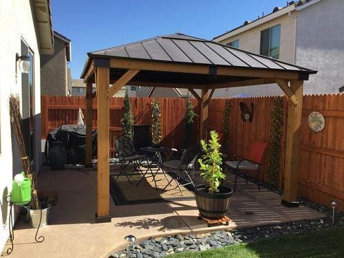 Customer photo review of SUNJOY 11x13 Wooden Gazebo with Solar Panel, LED Lights and Ceiling Hook - Driftwood Cedar