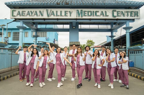 Customer photo review of 5-Pocket MoveTech® Scrub Top - Women / Mauve