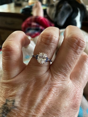 Customer photo review of Oval Cut Moissanite With Marquise Sapphire Petals Accents Engagement Ring