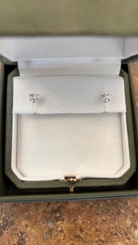 Customer photo review of M & Co. 3-Prong Martini Setting Diamond Stud Earrings