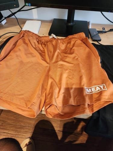 Customer photo review of SQUATTING SHORTS – RETRO / AMBER ORANGE
