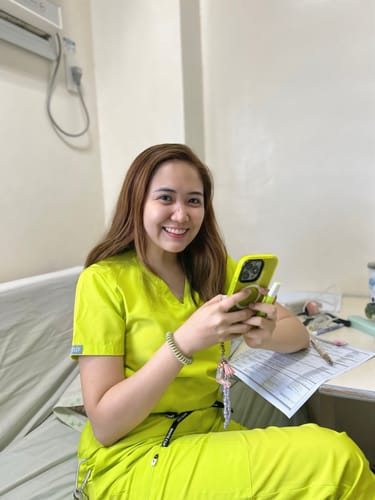 Customer photo review of 4-Pocket MoveTech® Scrub Top - Women / Atomic Yellow