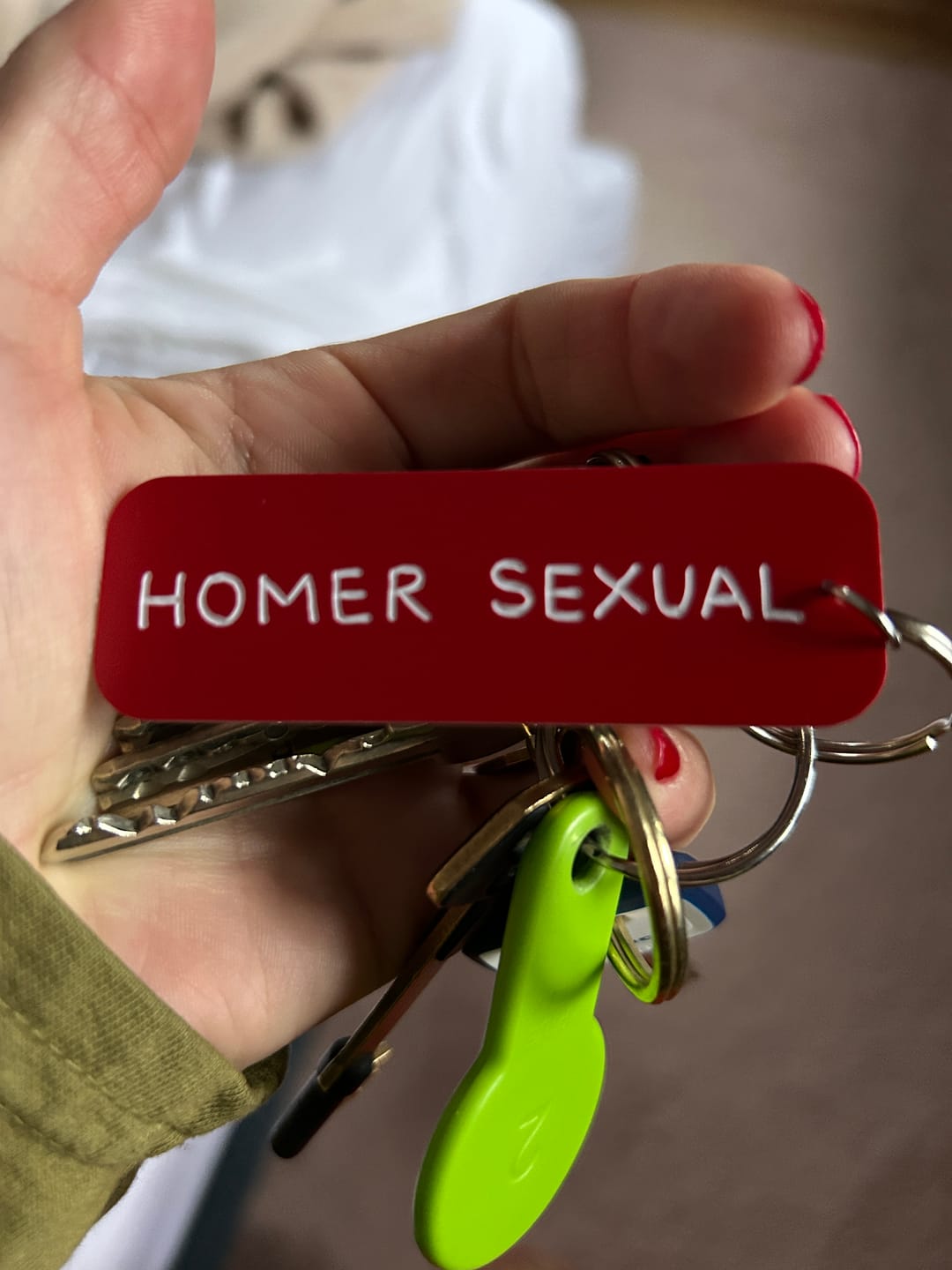 Customer photo review of Name Plate Keychain • Bart prank phone calls