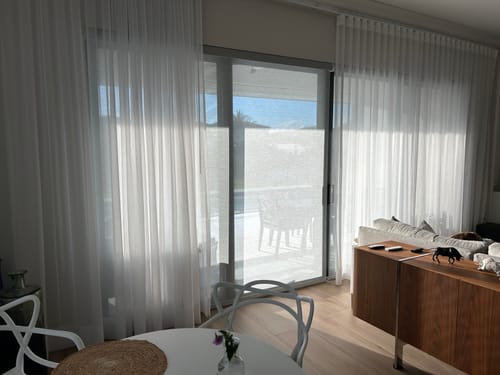 Customer photo review of SmartWings Motorized Light Filtering Roller Shades 50% Blackout PVC Free Sunscreen