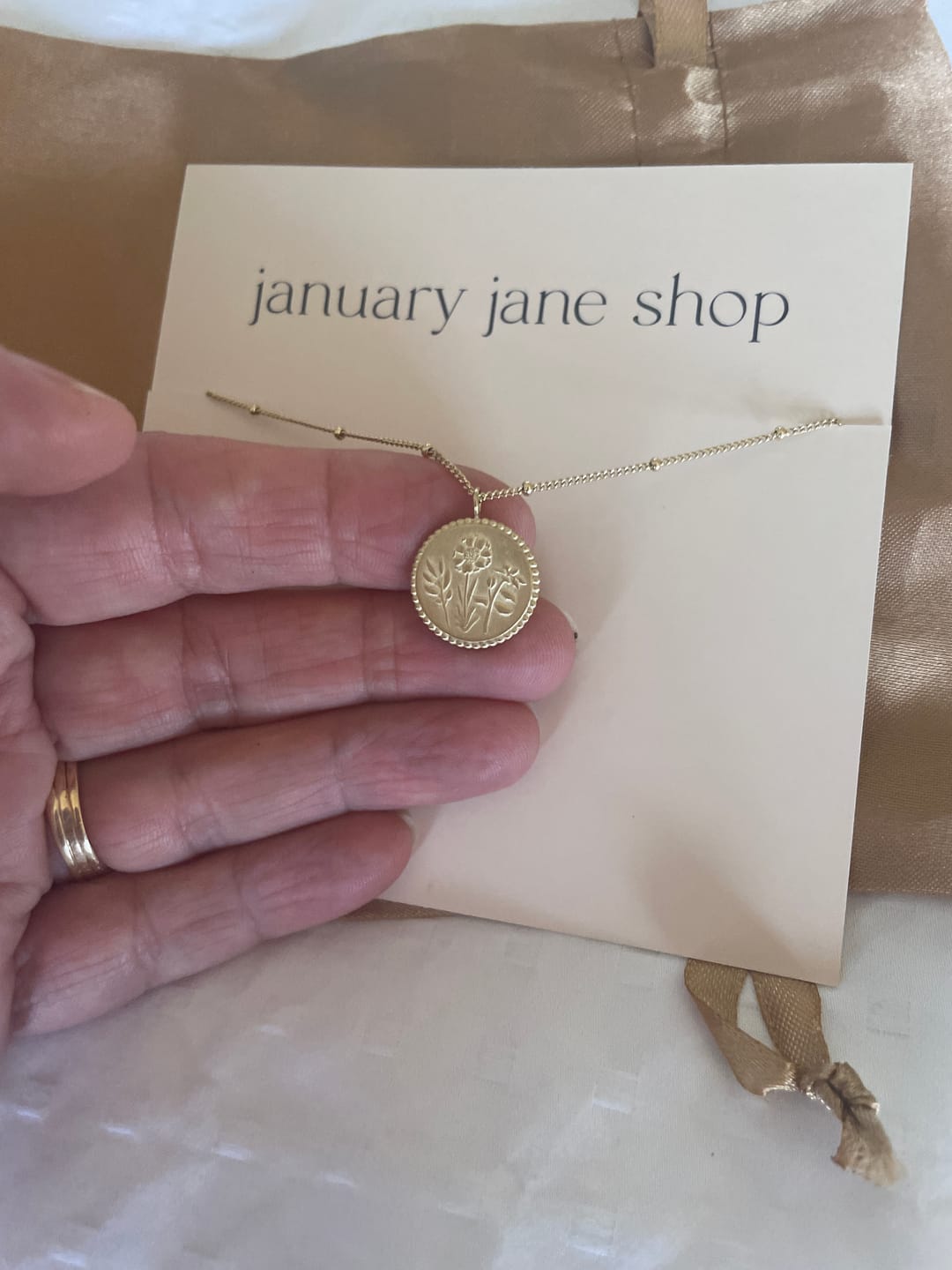 Customer photo review of Holy Family Floral Necklace - 14K Gold Filled