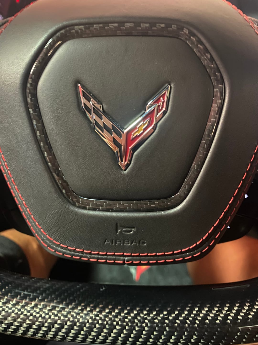 Customer photo review of C8 2020+ Corvette Carbon Fiber Steering Wheel Airbag Chrome Trim Delete Cover