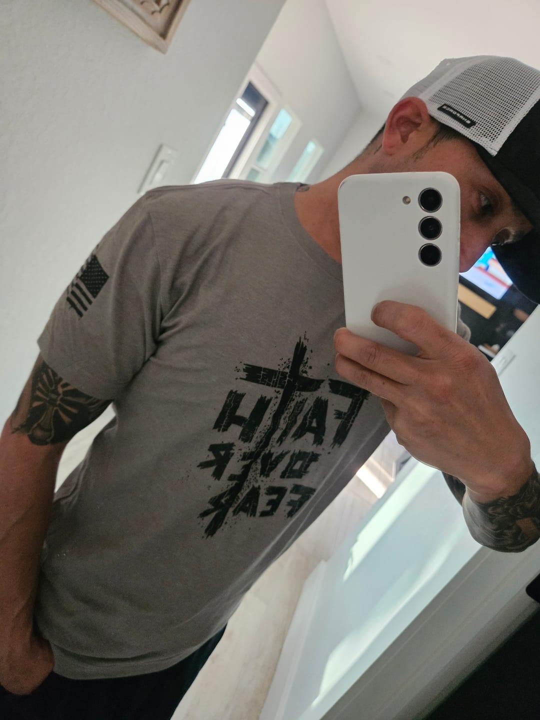 Customer photo review of Faith Over Fear Tee
