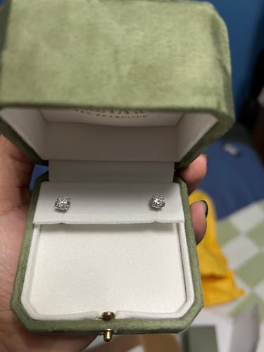 Customer photo review of M & Co. 4-Prong Martini Setting Diamond Stud Earrings