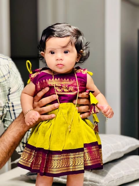 Customer photo review of Green and wine tie up dress for baby girl