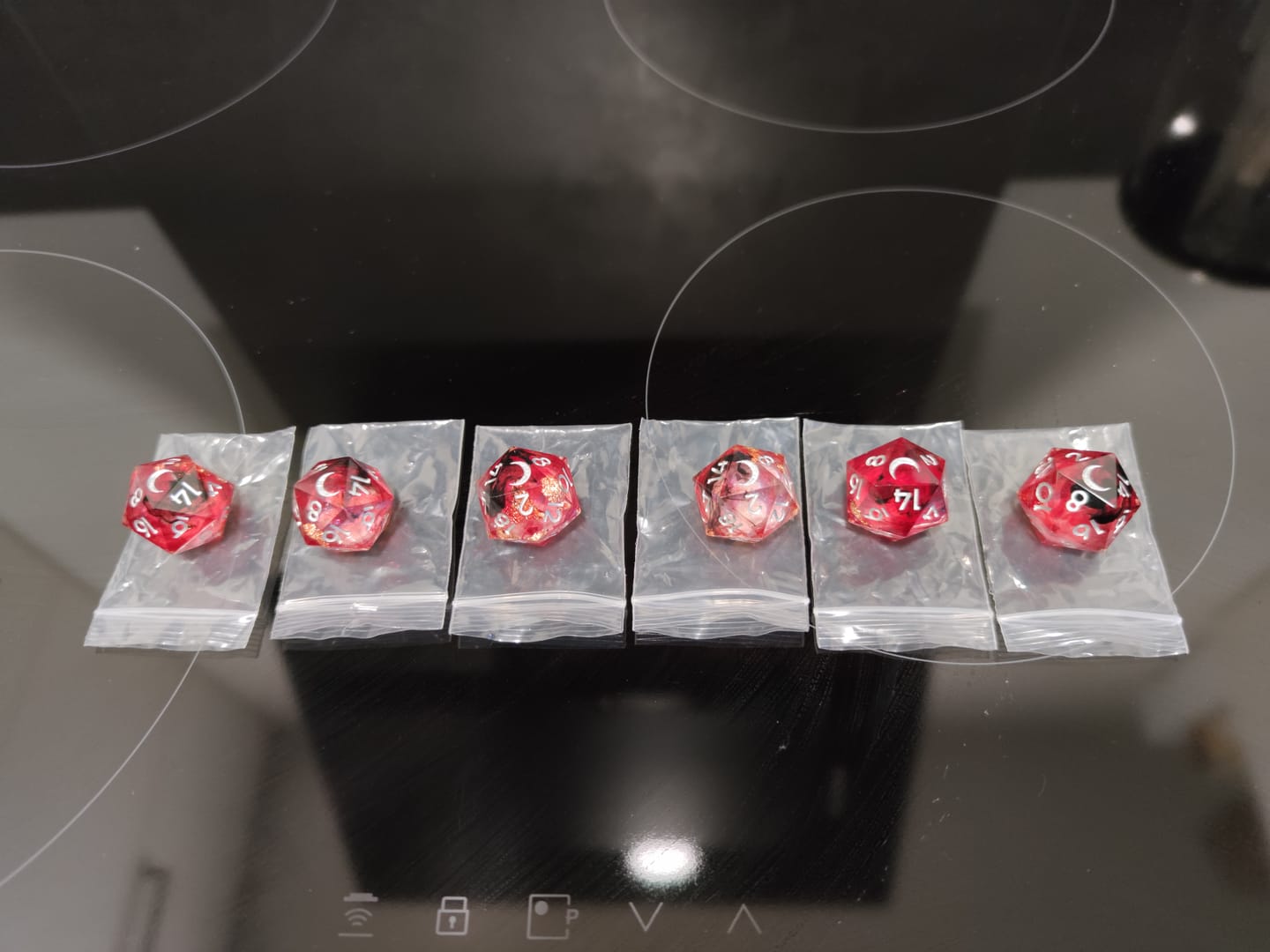 Customer photo review of URWizards D&D Bloody Liquid Heart Resin Engraved Dice Set Copper Flakes