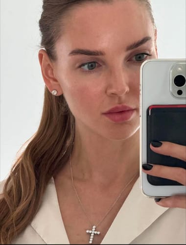 Customer photo review of Luxuria Moissanite 14K White Gold Plated Silver Stud Earrings
