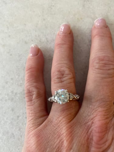 Customer photo review of Cathedral Round Moissanite Infinity Accents Engagement Ring