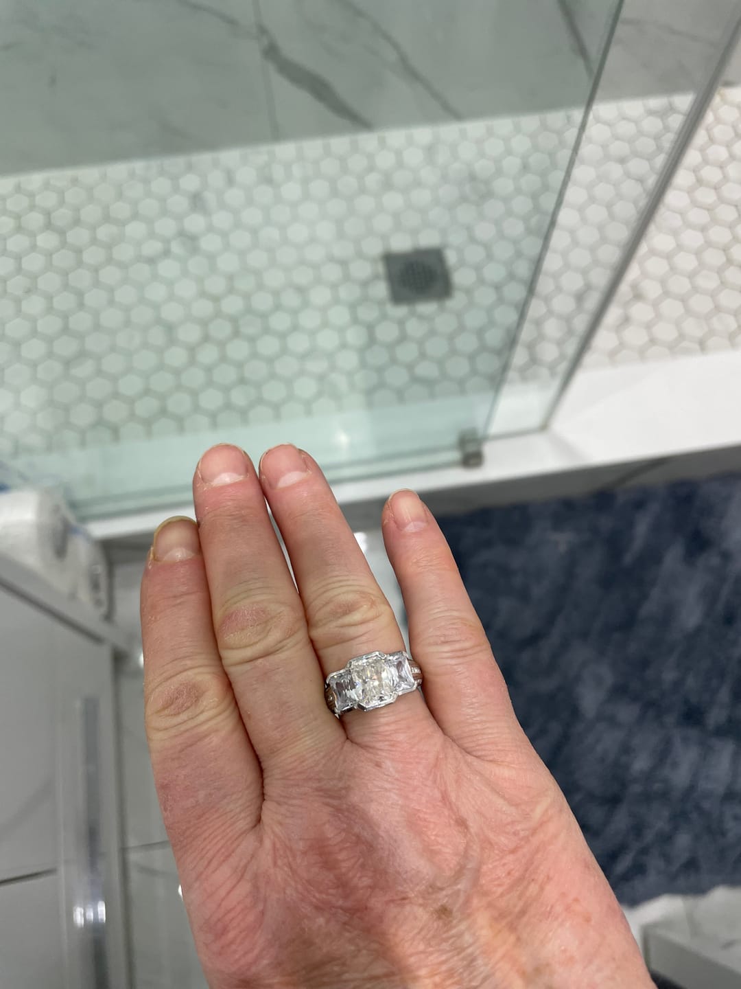 Customer photo review of Three Stone Radiant Moissanite Staircase Channel Set Euro Engagement Ring