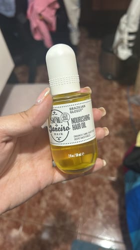Customer photo review of Brazilian Glossy Nourishing Anti-Frizz Hair Oil
