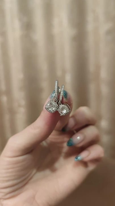 Customer photo review of Sterling Silver Huggie Hoop Earrings 2Ct Moissanite Center Stone — Silver | KIMLUD