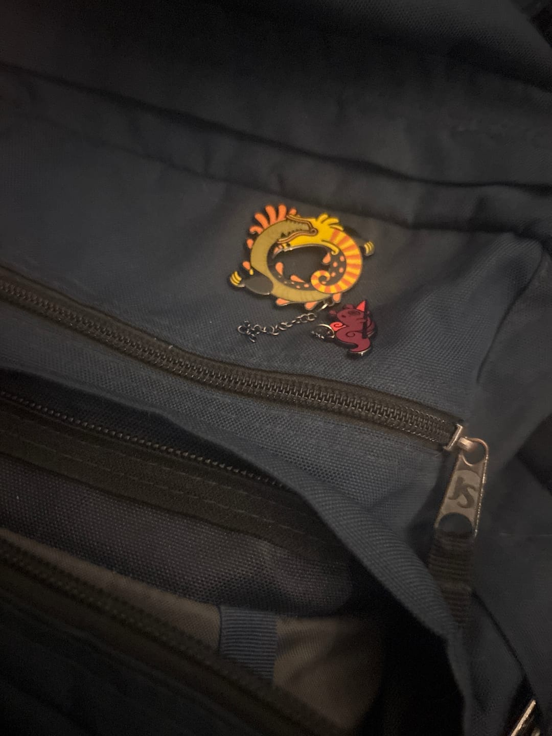 Customer photo review of Rain World - Yellow Lizard Hanger Pin