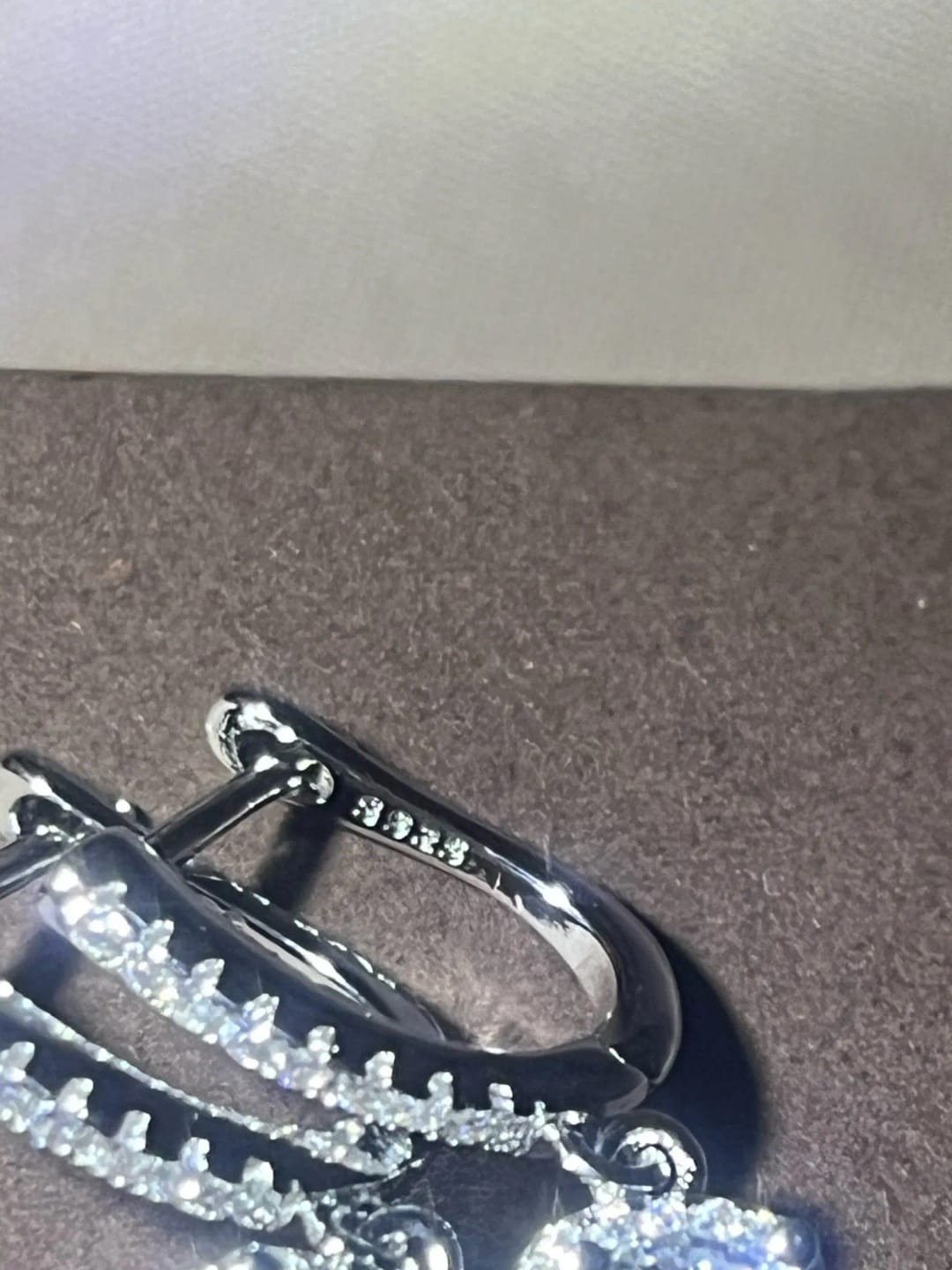 Customer photo review of Sterling Silver Huggie Hoop Earrings 2Ct Moissanite Center Stone — Silver | KIMLUD