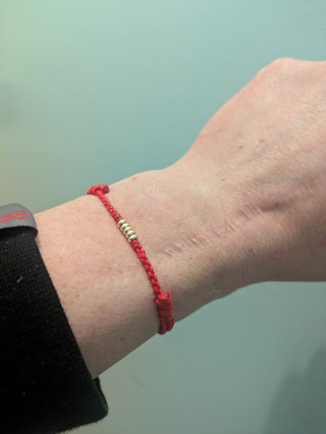 Customer photo review of Buddha Stones 925 Sterling Silver Lucky Golden Bead Braided String Bracelet Anklet