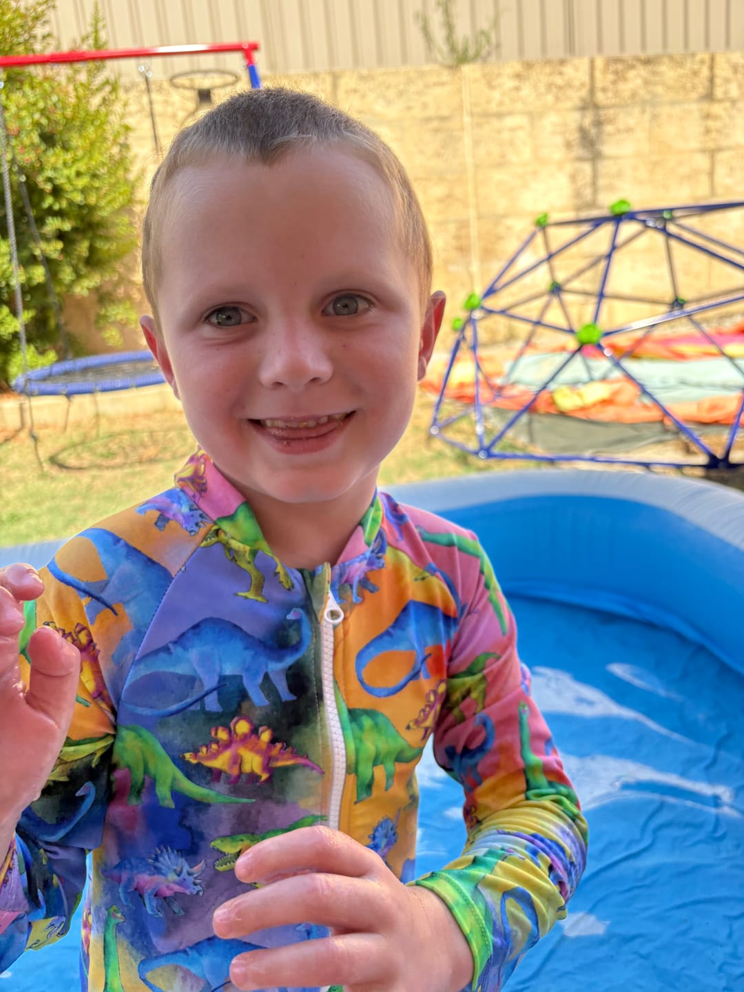 Customer photo review of Rainbow-saurus Unisex Long Sleeve Zip Swimmers